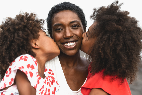 Happy African Family Having Fun on the Beach 
