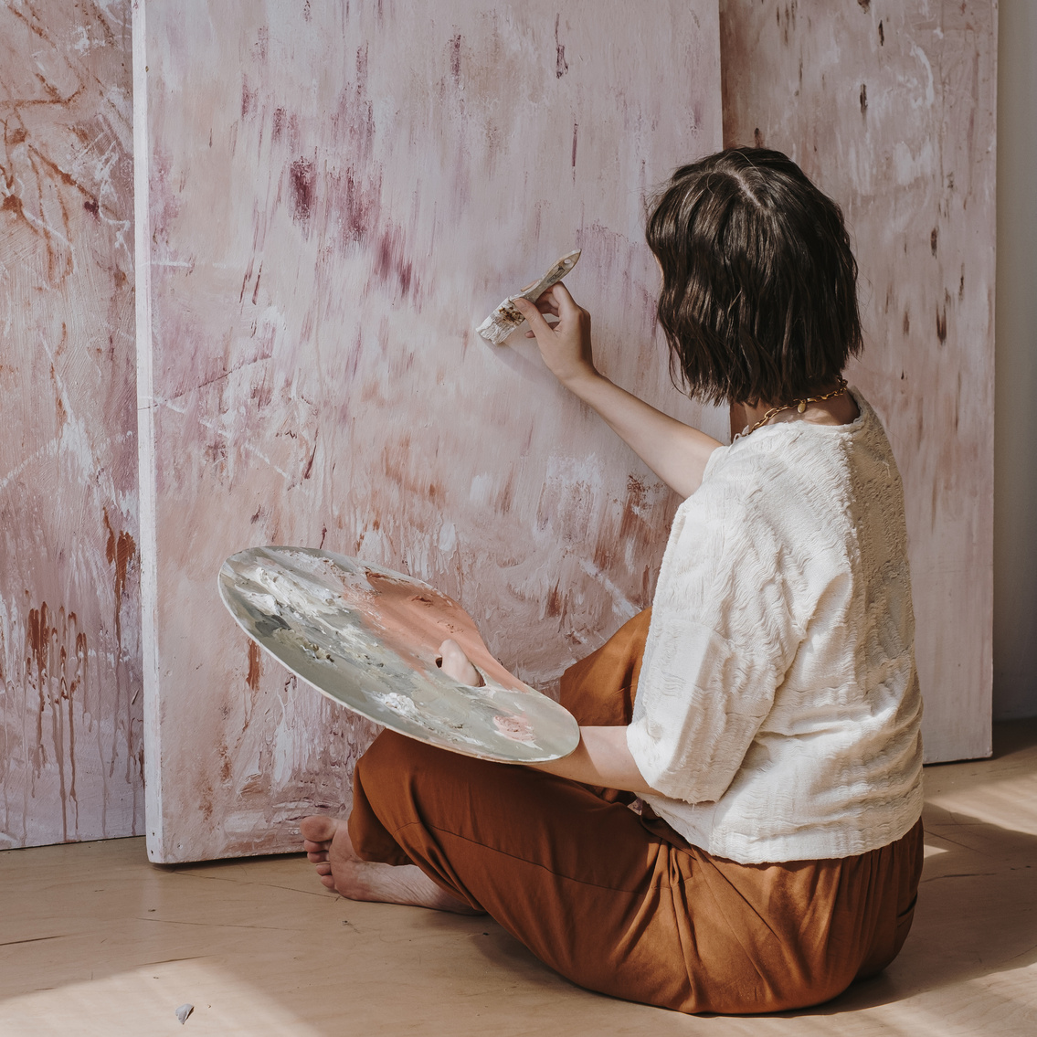 Woman Painting on Canvas